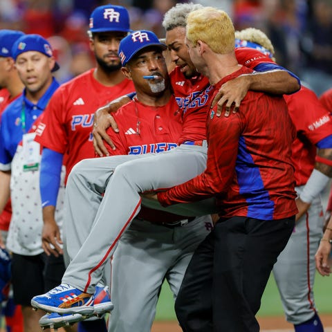 Puerto Rico pitcher Edwin Diaz is carried off the 