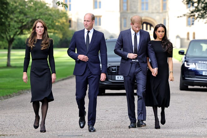 Catherine, Princess of Wales (from left), Prince William, Prince of Wales, Prince Harry, Duke of Sussex, and Meghan, Duchess of Sussex, on the long walk at Windsor Castle on Sept. 10, 2022, in Windsor, England.