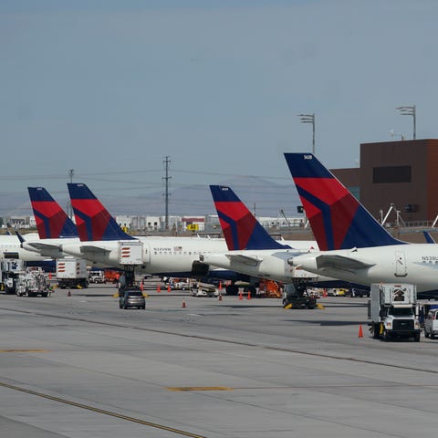 Delta Air Lines planes are shown at their gates at