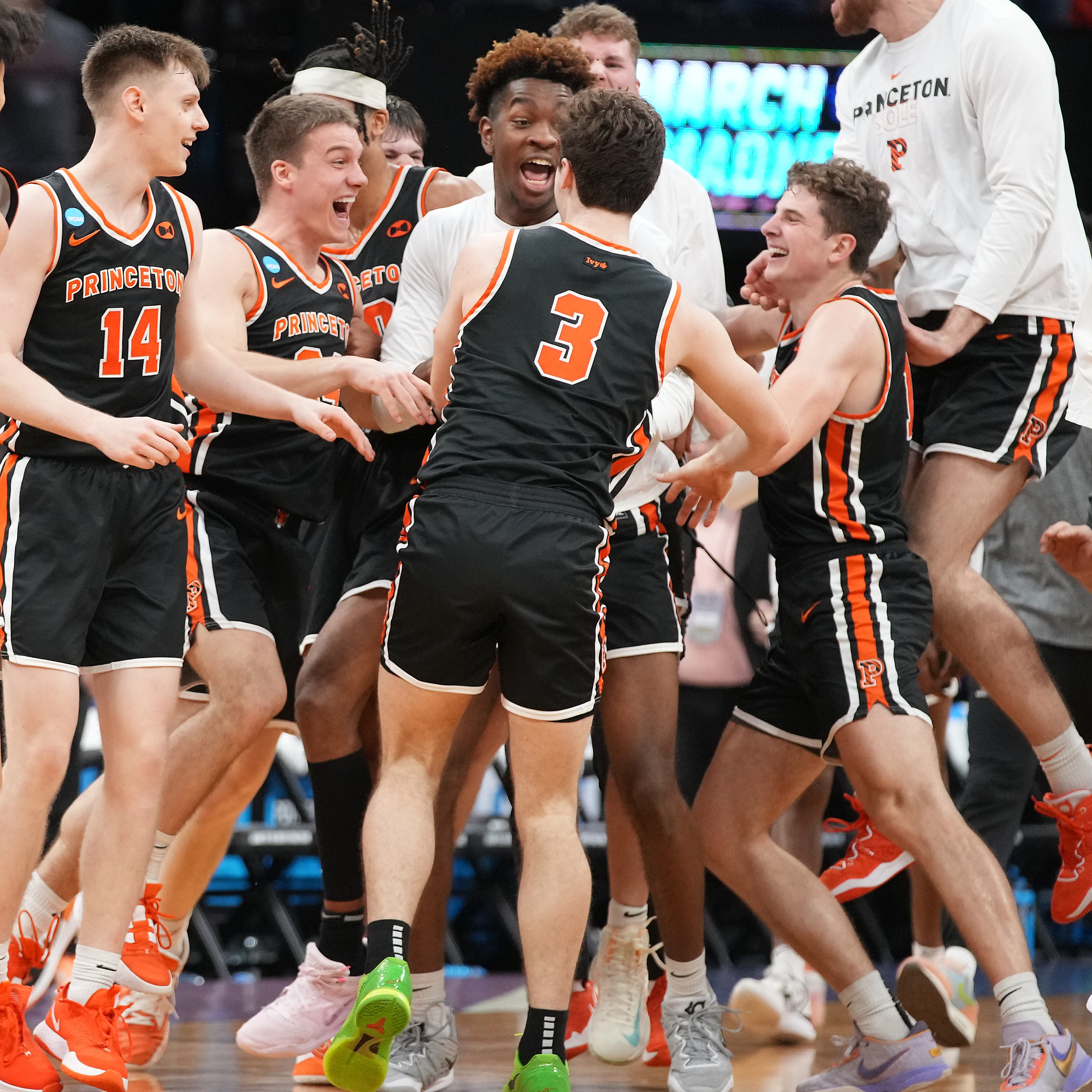 Princeton players celebrate after defeating Arizona in the first round of the 2023 NCAA men's tournament at Golden 1 Center.