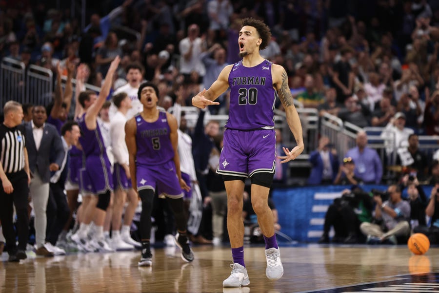 Furman forward Jalen Slawson celebrates a basket during the Paladins' upset win against Virginia during the second half of their first round men's NCAA Tournament game at Amway Center in Orlando, Florida.