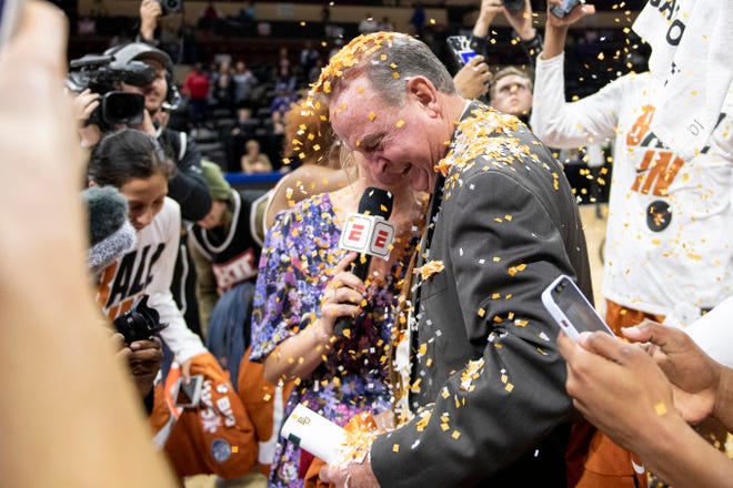 Texas players pour confetti over head coach Vic Schaefer after the Longhorns' win over Baylor in the 2022 Big 12 Tournament championship game. Schaefer, in his third season, has guided Texas to back-to-back Elite Eight appearances and has his team seeded No. 4 as it opens this year's NCAA Tournament.