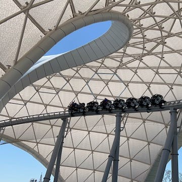 The ride launches guests outside, under a massive canopy, which lights up at night.