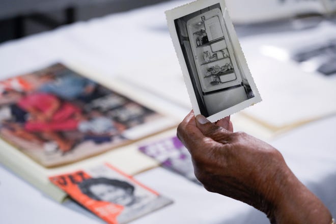Myrlie Evers-Williams looks at a photograph of a refrigerator filled with food that belonged to her and Medgar Williams, her husband who was assassinated in 1963. Evers-Williams donated her archival collection to her alma mater Pomona College.