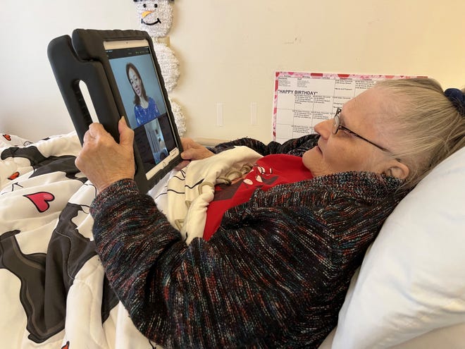 Bette Helm, who lives at the Acura Healthcare Nursing Home in Knoxville, Iowa, consults via iPad with Ayesha Macon, a psychiatric nurse practitioner, on March 1, 2023 in Austin, Texas.  Macon helps Helm brainstorm ways to overcome her anxiety and insomnia.  ,  Helm says that such appointments via video 