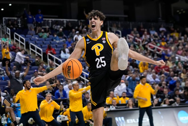 Pittsburgh forward Guillermo Diaz Graham (25) reacts after scoring during the second half of a first-round college basketball game against Iowa State in the NCAA Tournament on Friday, March 17, 2023, in Greensboro, N.C. (AP Photo/John Bazemore)