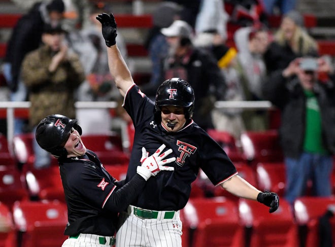 Texas Tech third baseman Kevin Bazzell, right, scores the game-winning run in the 10th inning of the Red Raiders' 8-7 victory Friday night against Oklahoma State. At left is Tech catcher Hudson White.