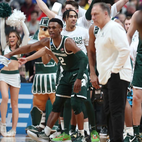 Michigan State guard Tyson Walker (2) reacts after