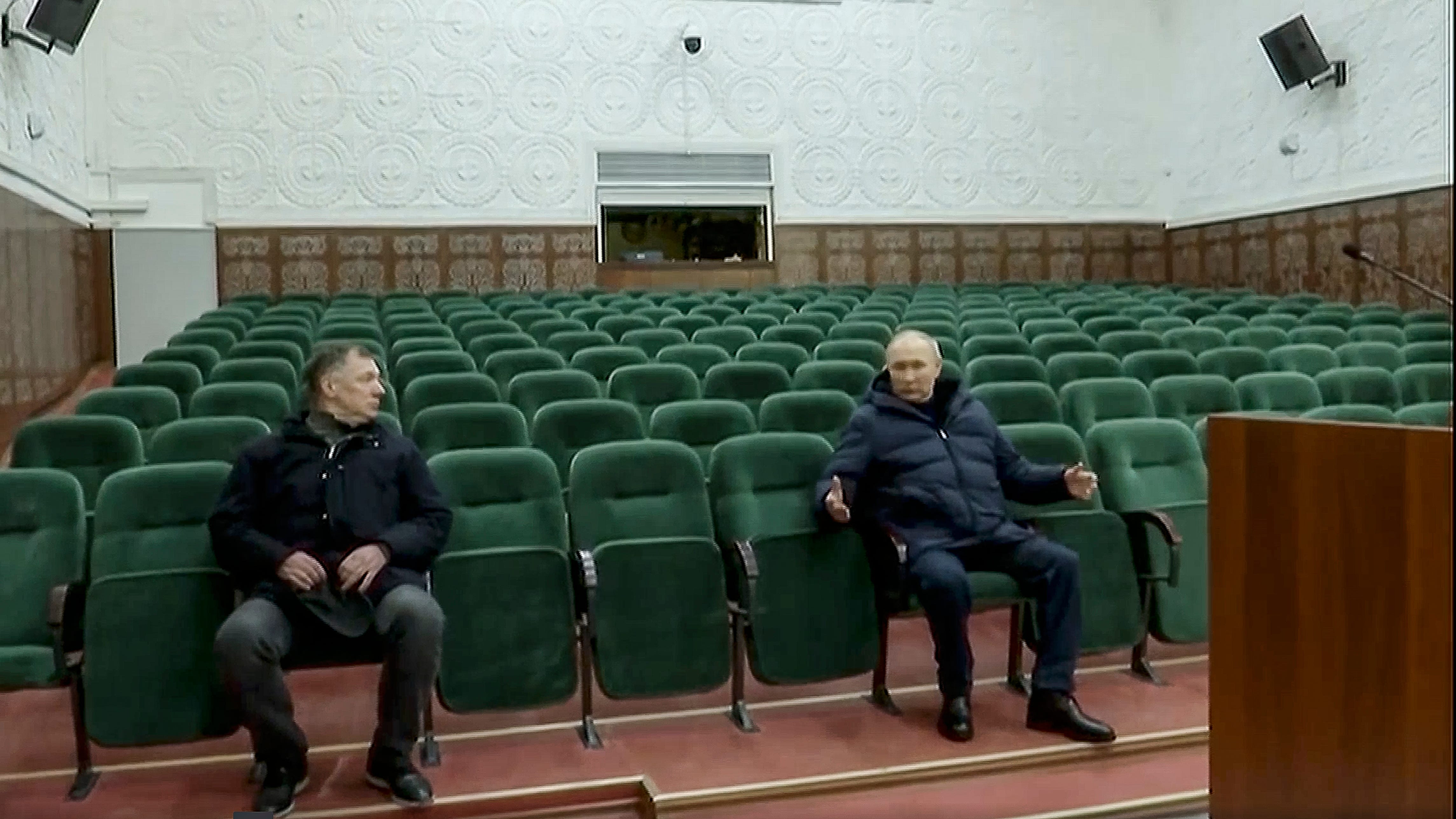 In this photo taken from video released by Russian TV Pool on Sunday, March 19, 2023, Russian President Vladimir Putin gestures while speaking to Russian Deputy Prime Minister Marat Khusnullin, left, at the Mariupol theater during his visit to Mariupol in Russian-controlled Donetsk region, Ukraine. Putin has traveled to Crimea to mark the ninth anniversary of the Black Sea peninsula's annexation from Ukraine. (Pool Photo via AP)