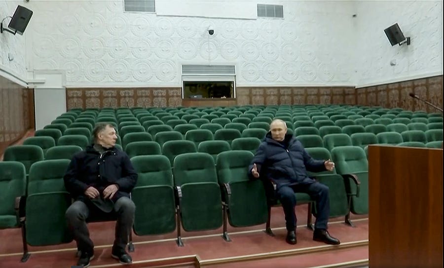 In this photo taken from video released by Russian TV Pool on Sunday, March 19, 2023, Russian President Vladimir Putin gestures while speaking to Russian Deputy Prime Minister Marat Khusnullin, left, at the Mariupol theater during his visit to Mariupol in Russian-controlled Donetsk region, Ukraine. Putin has traveled to Crimea to mark the ninth anniversary of the Black Sea peninsula's annexation from Ukraine. (Pool Photo via AP)