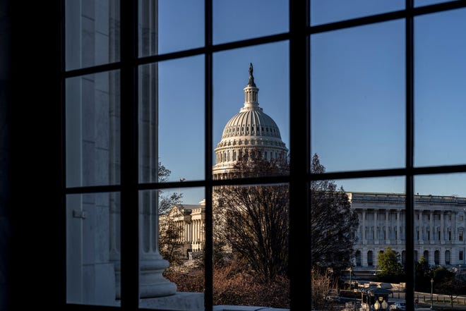 The Capitol is seen through a window in the Russell Senate Office Building as policymakers wrestle with fallout from the failure of Silicon Valley Bank, in Washington, Wednesday, March 15, 2023.