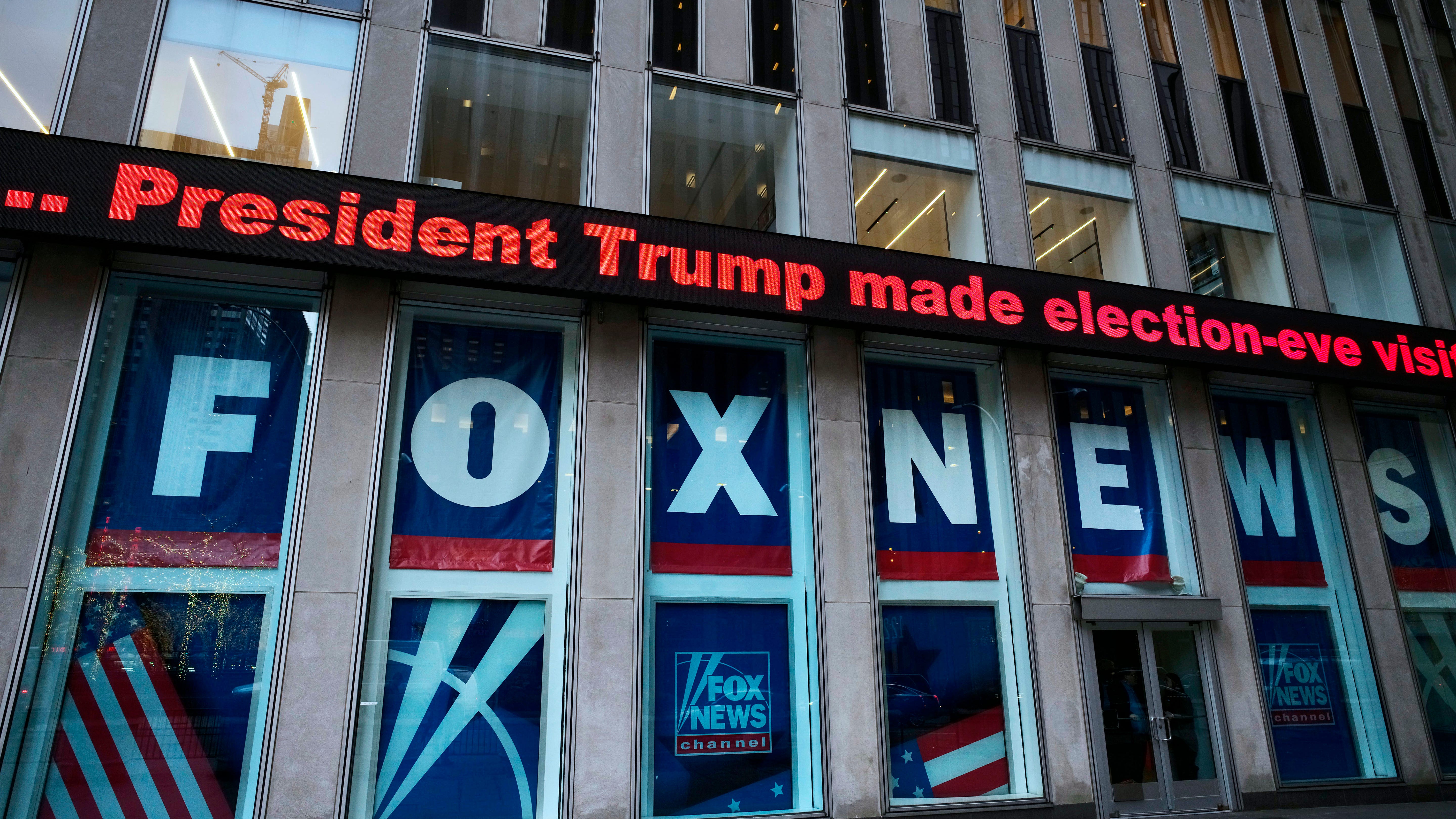 FILE - A headline about President Donald Trump is displayed outside Fox News studios in New York on Nov. 28, 2018. Documents in defamation lawsuit illustrate pressures faced by Fox News journalists in the weeks after the 2020 presidential election. The network was on a collision course between giving its conservative audience what it wanted and reporting uncomfortable truths about then-President Donald Trump and his false fraud claims. (AP Photo/Mark Lennihan, File) ORG XMIT: WX201