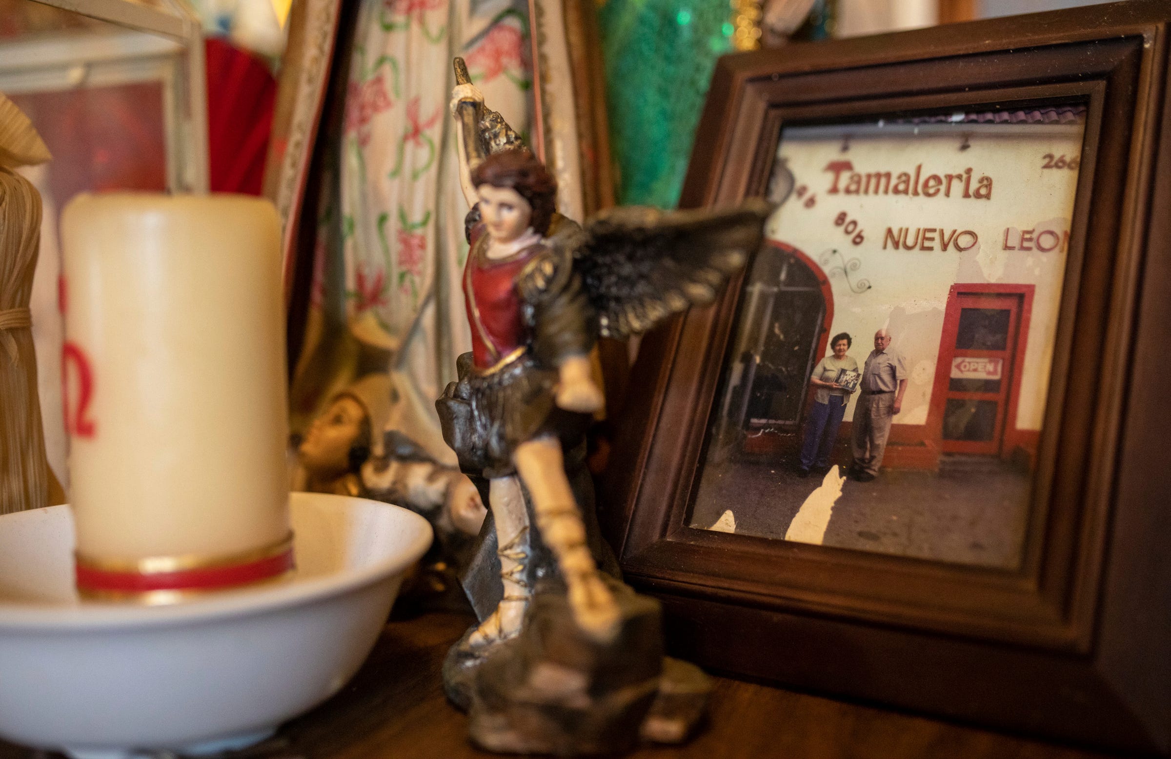 A photo of Maria Alicia Villarreal, the past owner of Tamaleria Nuevo Leon, and her husband, Pedro Villarreal, standing in front of Tamaleria Nuevo Leon, sits on a small table inside the business in Detroit's Mexicantown on Friday, March 3, 2023.