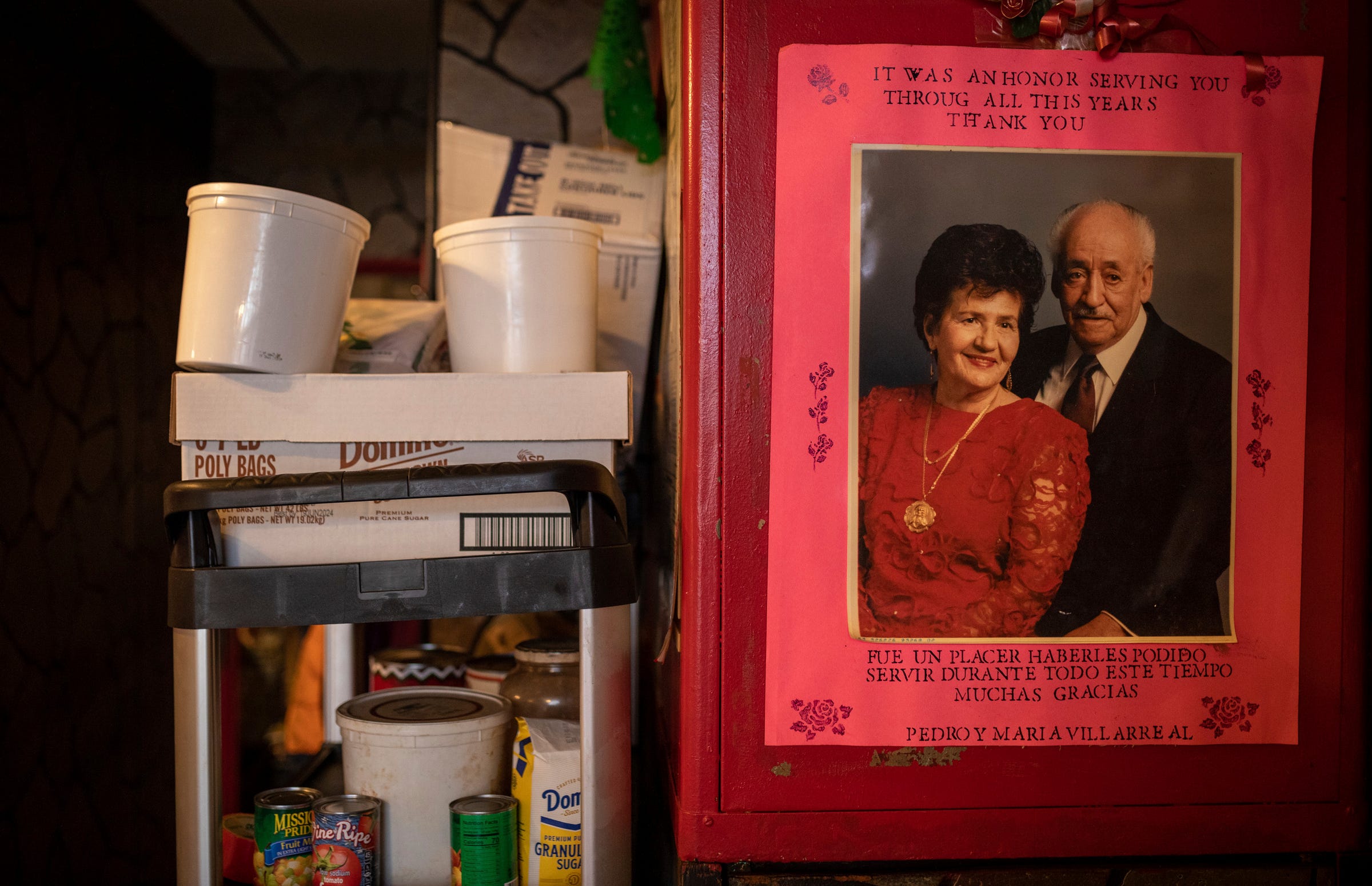 A photo of Maria Alicia Villarreal, the past owner of Tamaleria Nuevo Leon and her husband Pedro Villarreal, hangs inside the business in Detroit's Mexicantown on Friday, March 3, 2023. 