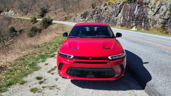 You'll know the 2023 Dodge Hornet by its twin hood air extractors, raccoon grille and mail slot. Hot Tamale red optional.