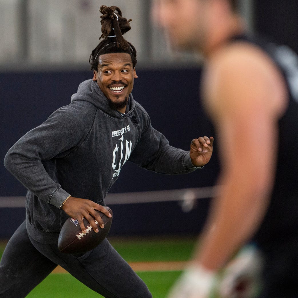 Former Auburn quarterback and NFL MVP Cam Newton runs a drill during Auburn Tigers Pro Day at Woltosz Football Performance Center in Auburn, Ala., on Tuesday, March 21, 2023.