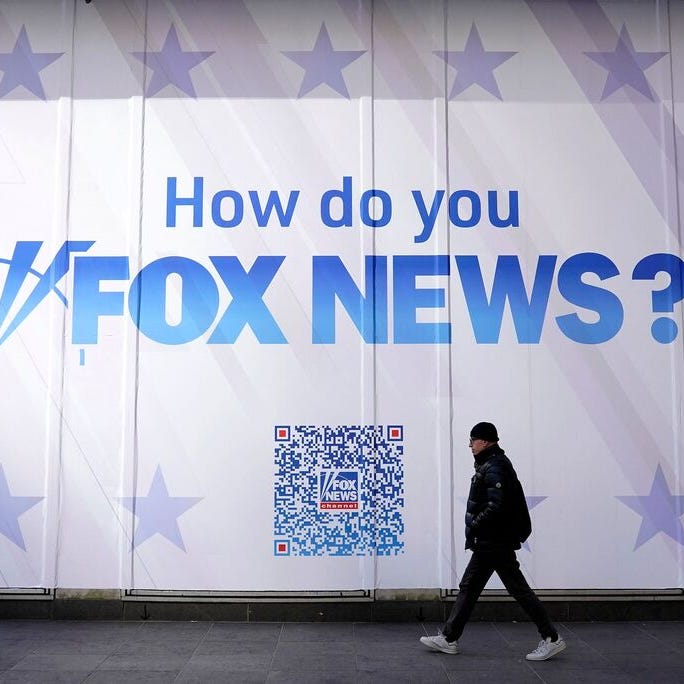 A person walks past the Fox News Headquarters at the News Corporation building in New York City on March 9, 2023.