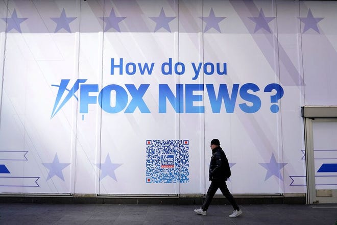 A person walks past the Fox News Headquarters at the News Corporation building in New York City on March 9, 2023.