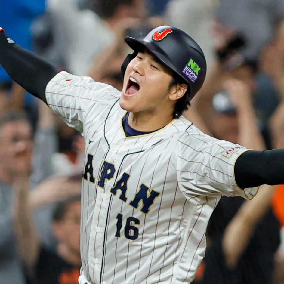 Shohei Ohtani circles the bases after a three-run home run by Masataka Yoshida against Mexico.
