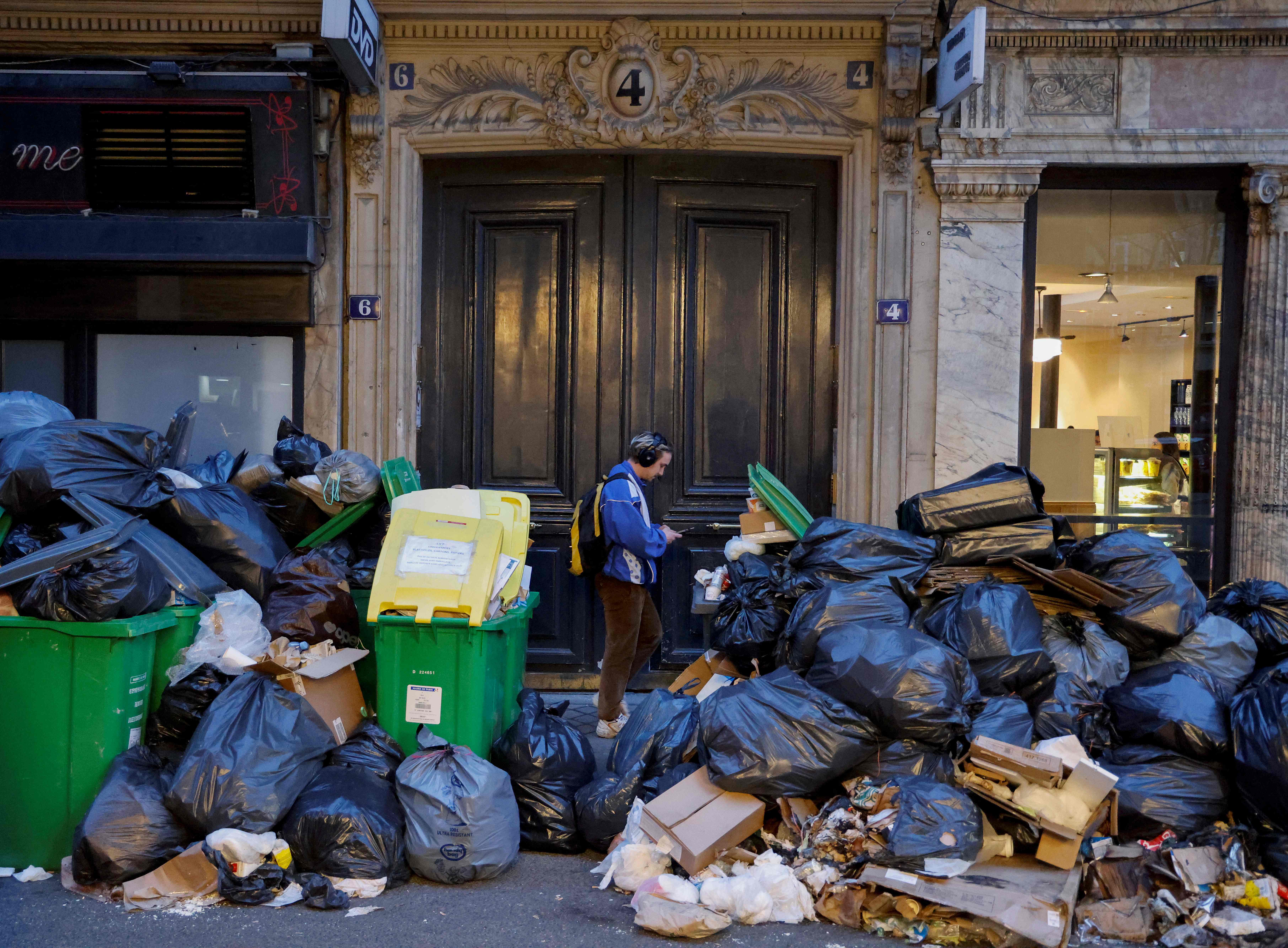 Heaps of trash pile up on Paris streets amid protests against France retirement law: Photos