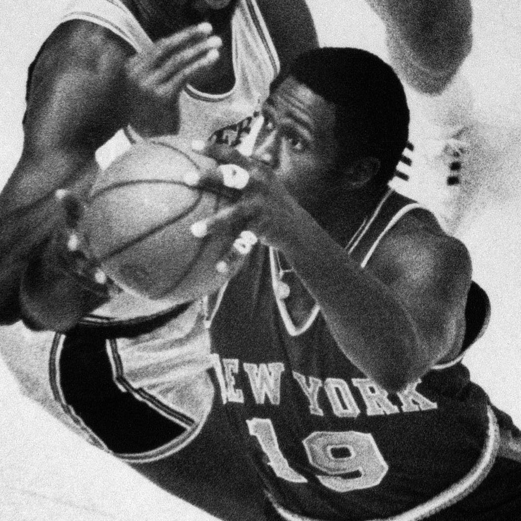 New York Knicks center Willis Reed drives to the basket against the Los Angeles Lakers' Wilt Chamberlain in Game 4 of the 1970 NBA Finals.