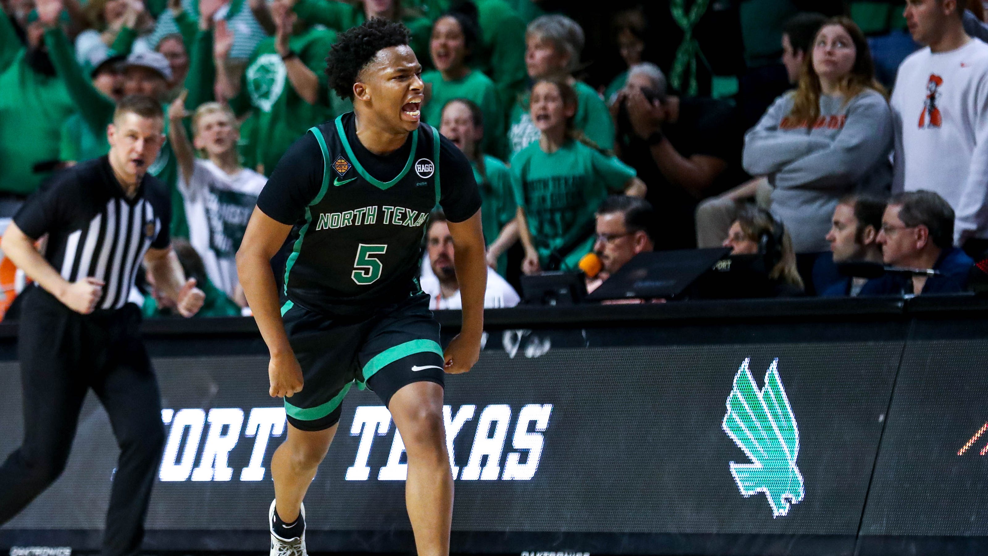 North Texas guard Tylor Perry (5) celebrates in overtime during a college basketball game in the quarterfinals of the National Invitational Tournament between the Oklahoma State Cowboys (OSU) and the North Texas Mean Green at Gallagher-Iba Arena in Stillwater, Okla., Tuesday, March 21, 2023. - Wisconsin Badgers