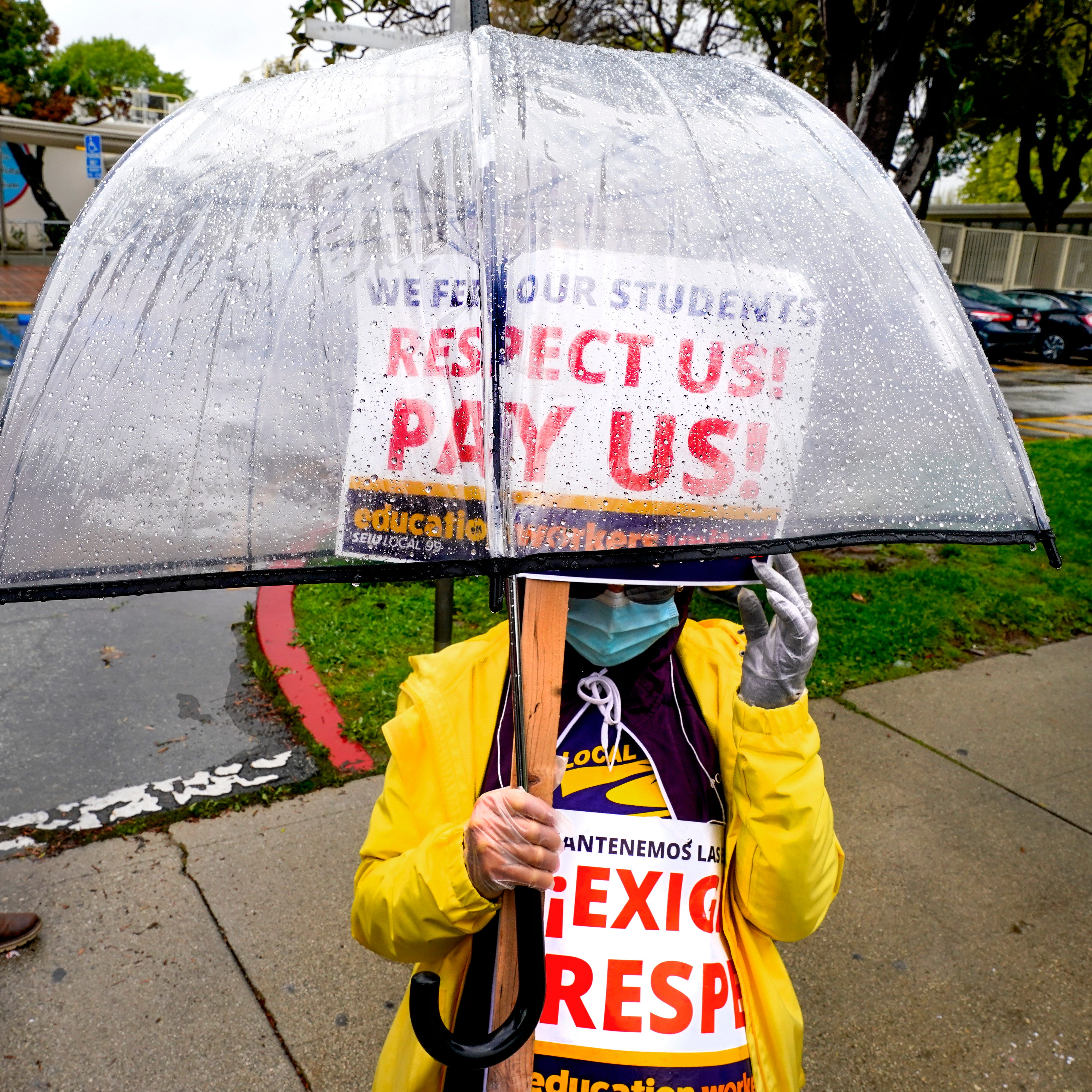 Striking Los Angeles Unified School District employees picket in front of Monroe High School. More than 60,000 bus drivers, custodians, cafeteria employees, campus security, teaching assistants and educators from the Los Angeles Unified School District are striking from March 21 to 23.