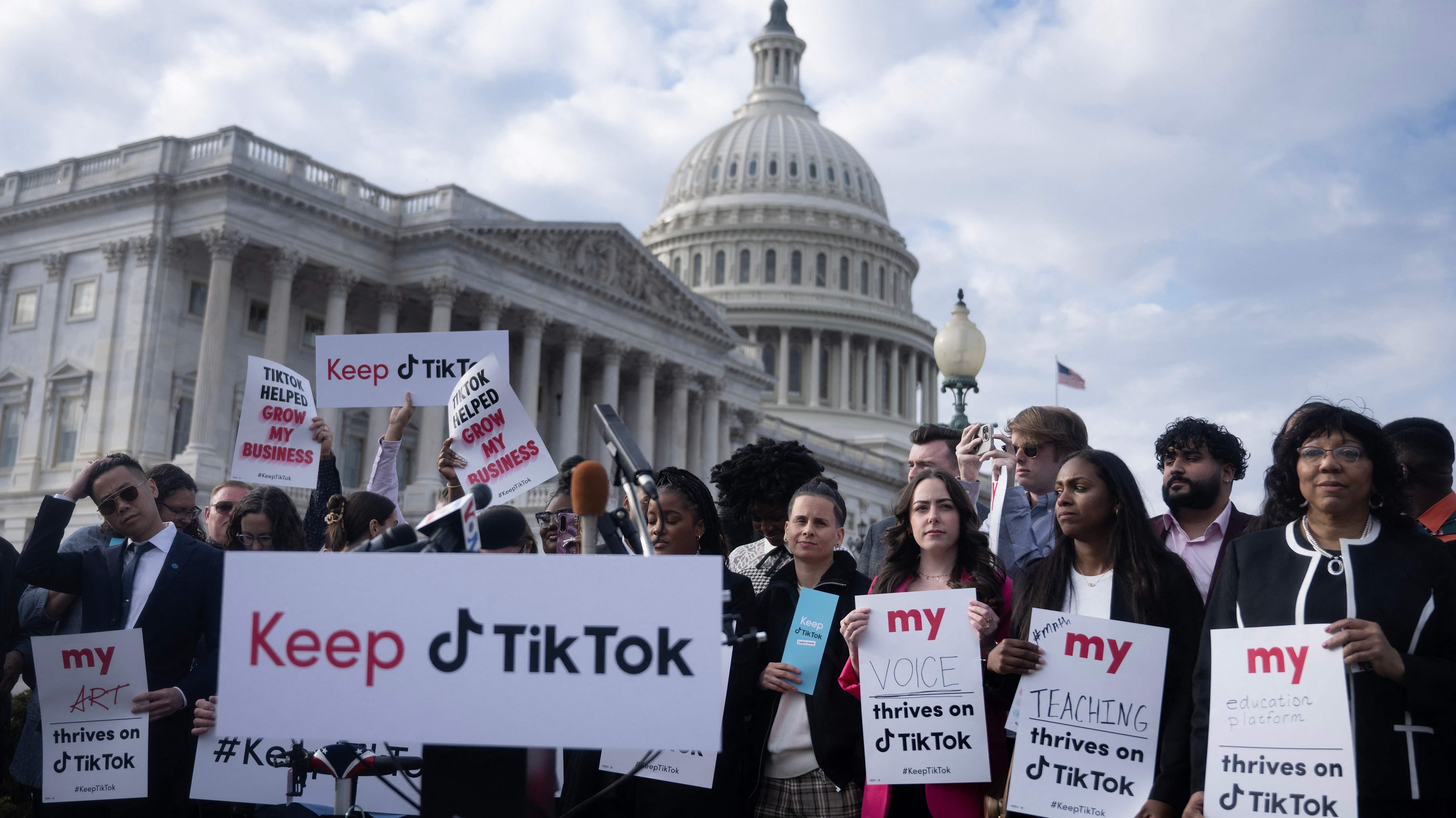 People gather for a press conference about their opposition to a TikTok ban on Capitol Hill in Washington, DC on March 22, 2023.