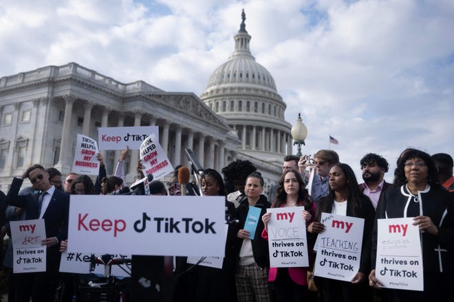 People gather for a press conference about their opposition to a TikTok ban on Capitol Hill in Washington, DC on March 22, 2023.