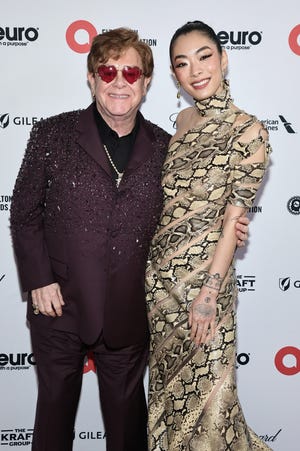 Elton John, left, and Rina Sawayama at his Academy Awards viewing party in West Hollywood, California, earlier this month.