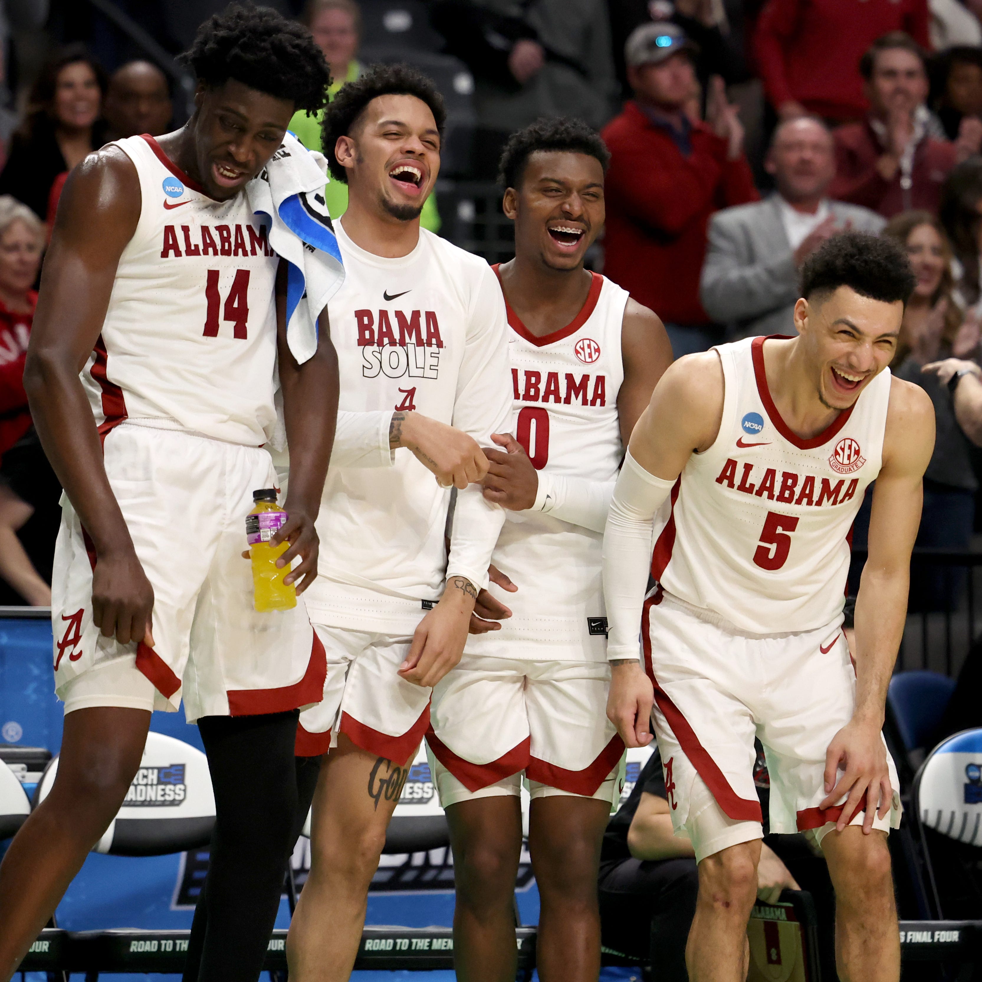 Alabama players on the bench celebrate near the end of the second half of the team's NCAA men's tournament game against Maryland at Legacy Arena.