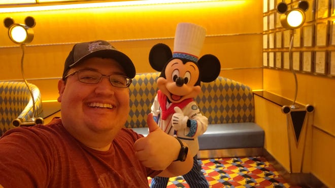 Nathan Firesheets takes a selfie with Chef Mickey at a hotel restaurant in Tokyo.