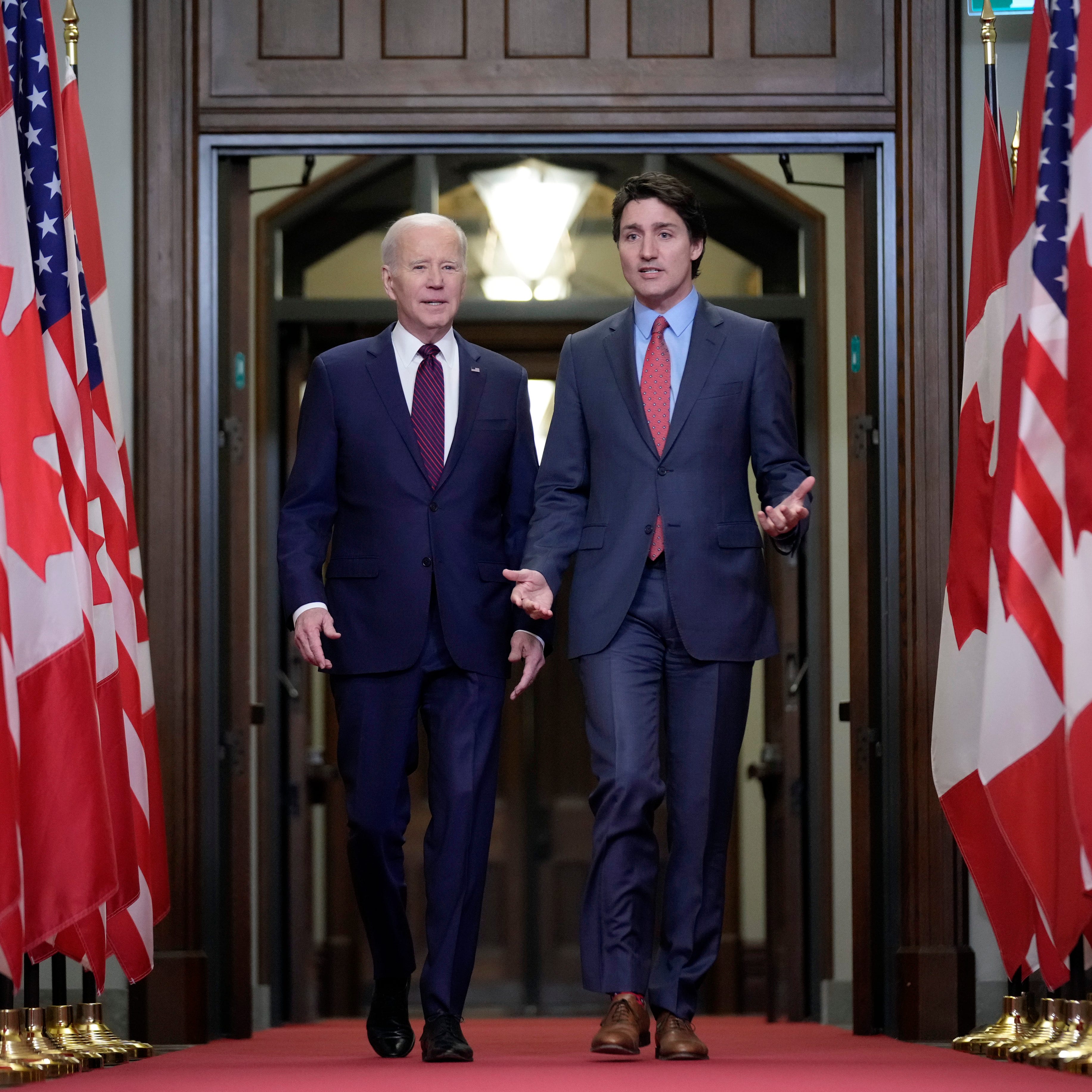 President Joe Biden walks with Canadian Prime Minister Justin Trudeau during an arrival ceremony at Parliament Hill, Friday, March 24, 2023, in Ottawa, Canada. (AP Photo/Andrew Harnik)