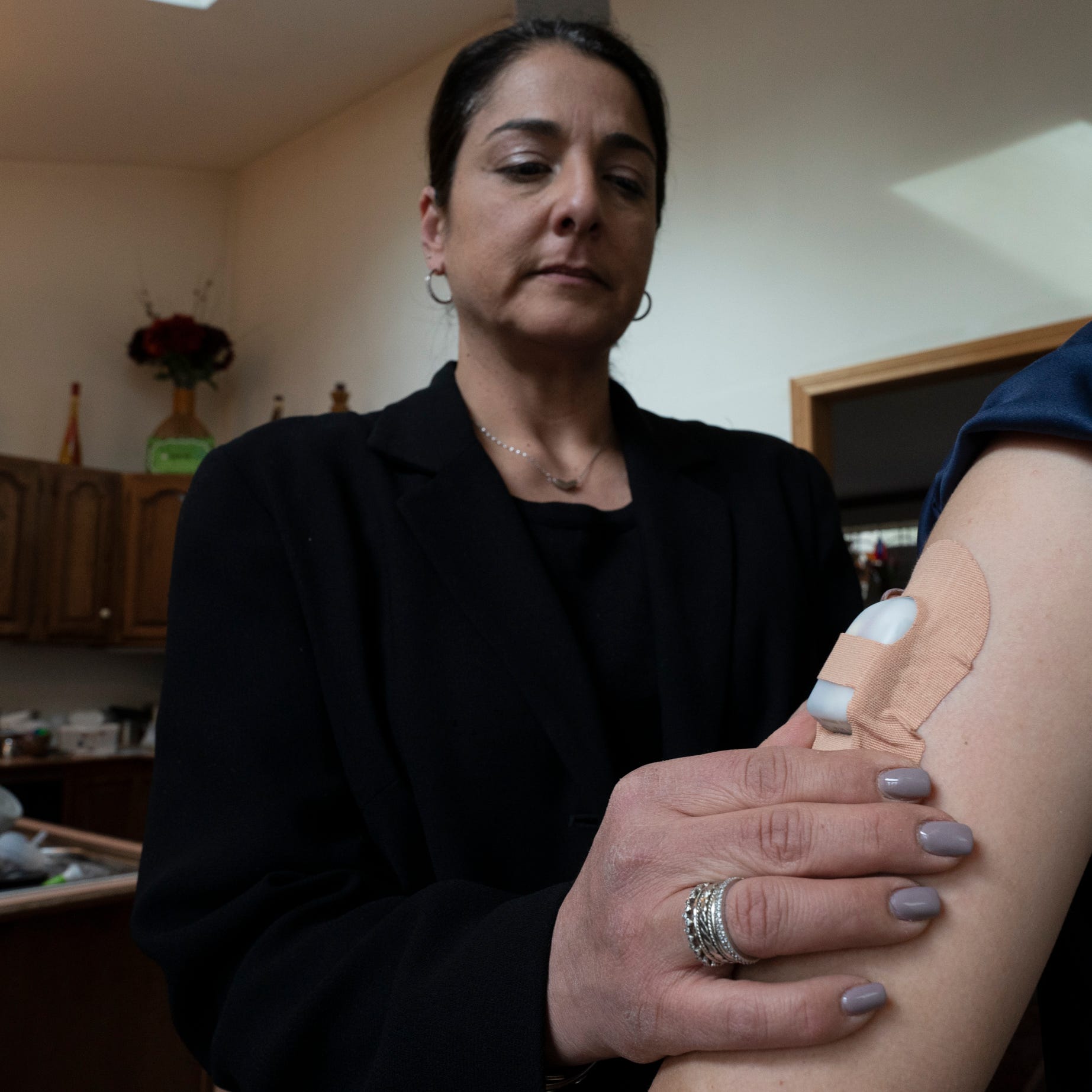 Mar 24, 2023; Millwood, NY, USA; Maria Chiodi of Millwood, NY, treats her 12-year-old son's Type 1 diabetes with an Omnipod 5 insulin pump. While the three largest makers of insulin have announced plans to slash prices, the cost of the medication is just one of many expenses people with diabetes must cover.  A dispute between Chiodi's health insurer and the company that makes the pump leaves her with a monthly bill of $872 for his care. Mandatory Credit: John Meore-USA TODAY