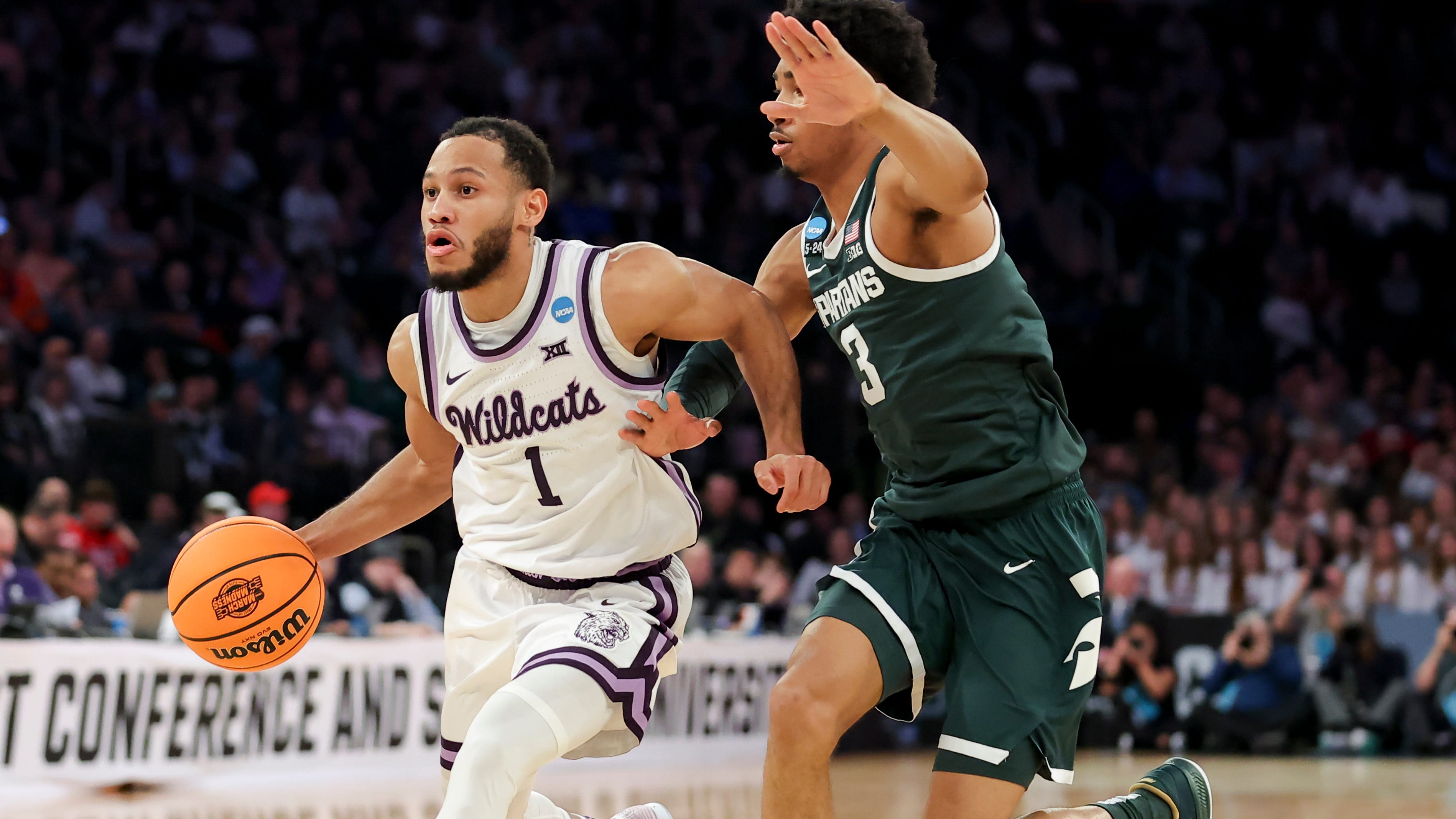Kansas State guard Markquis Nowell (1) drives to the basket against Michigan State guard Jaden Akins during the first half of their NCAA men's tournament game at Madison Square Garden.