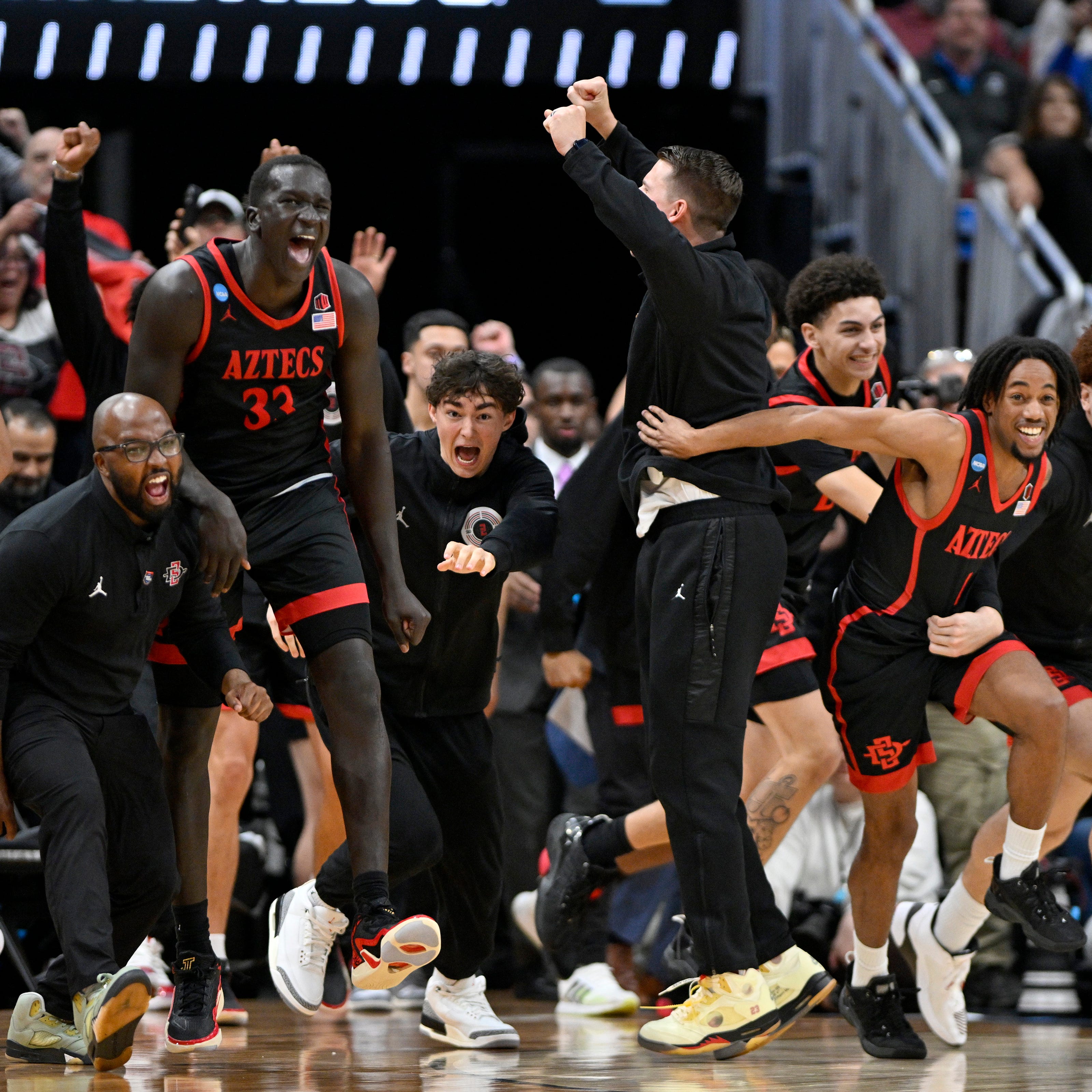 San Diego State players celebrate after defeating Alabama in the Sweet 16.