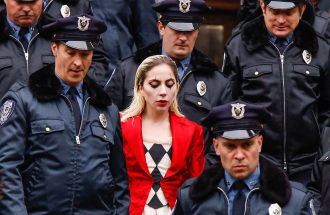 Photos from the "Joker" sequel were captured in New York City and showed Lady Gaga surrounded by police while wearing a Joker-like costume.