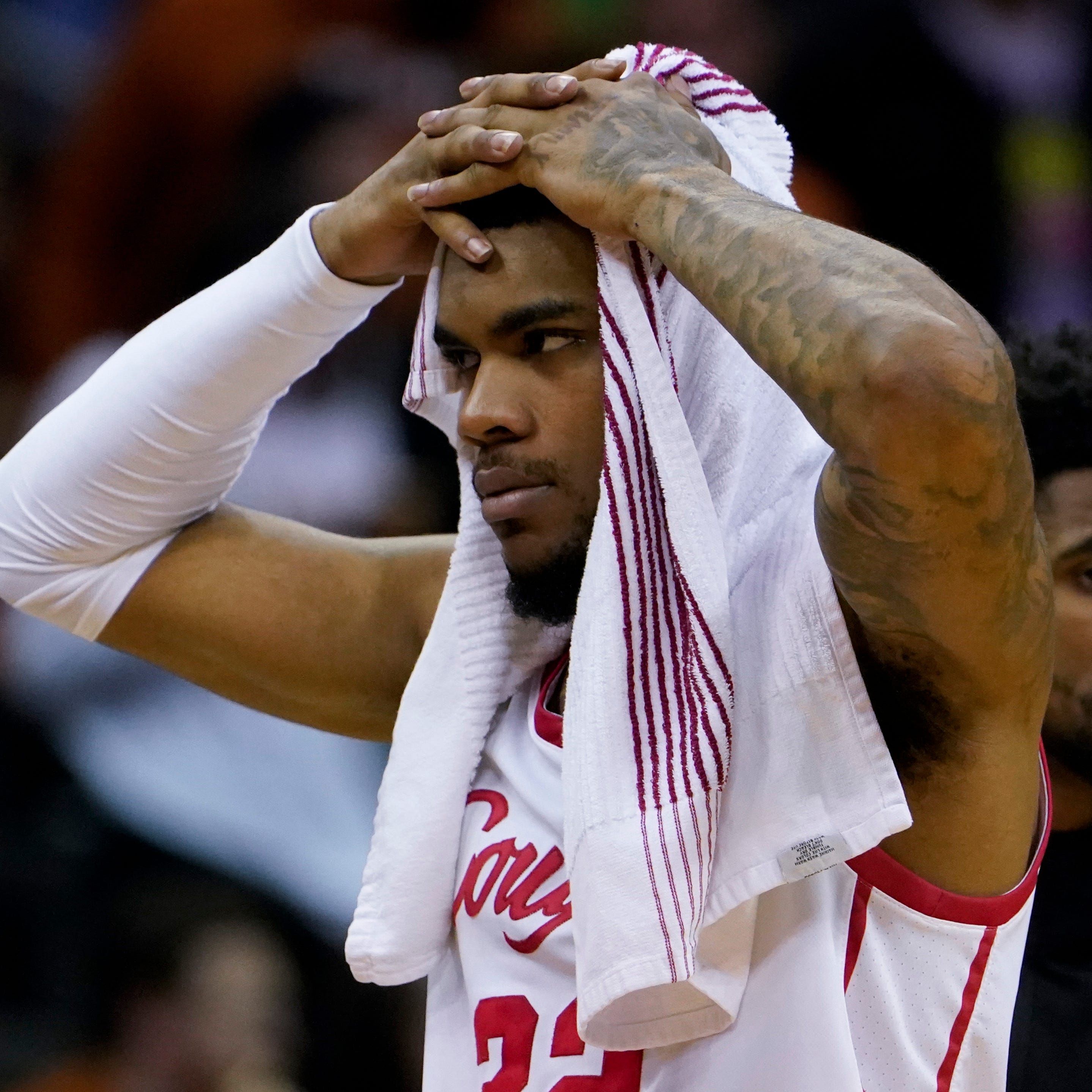 Houston forward Reggie Chaney leaves the court after the loss against Miami.