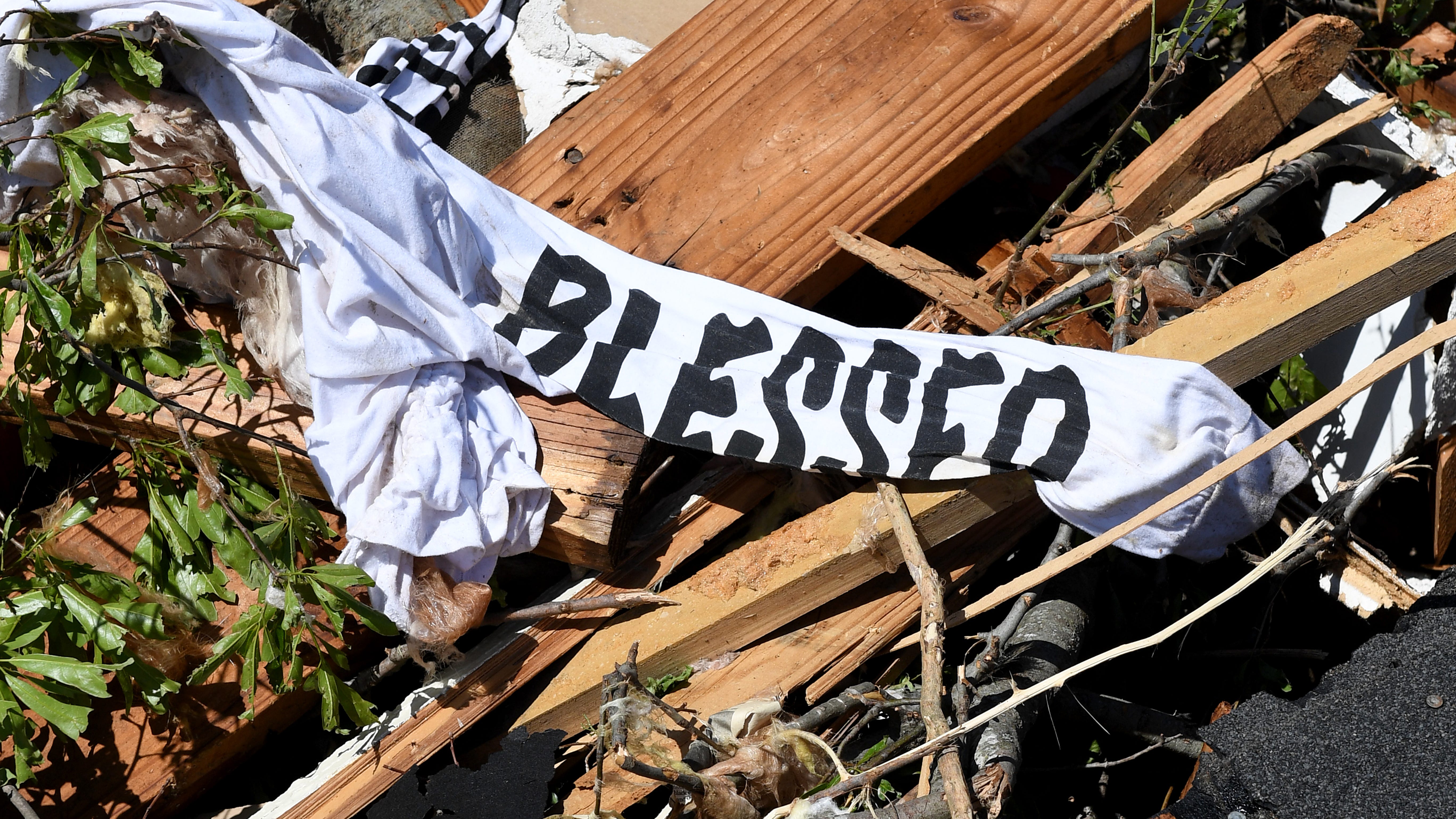 A piece of fabric rests amid debris from a series of powerful storms and at least one tornado on March 25, 2023, in Rolling Fork, Mississippi.
