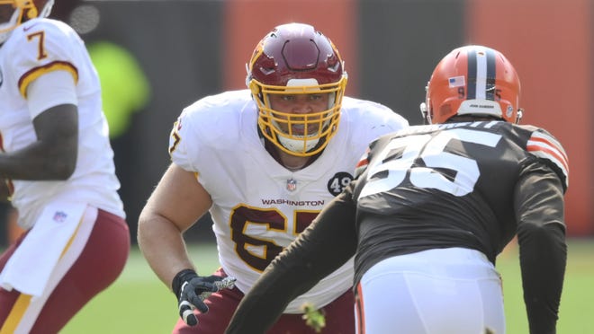 Wes Martin looks to block Browns defensive end Myles Garrett while playing for the Washington Football Team during a 2020 game in Cleveland.