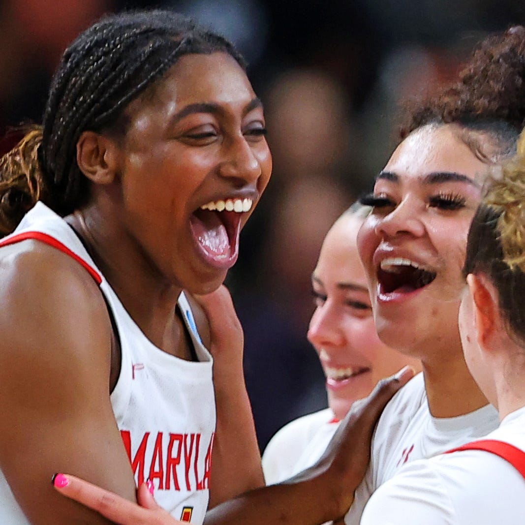 Diamond Miller (left) celebrates with her teammates after Maryland beat Notre Dame to advance to the Elite 8.