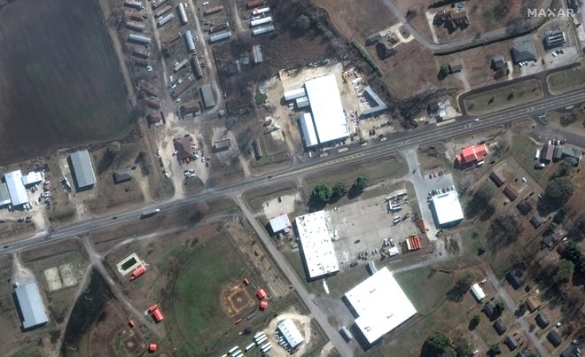 This satellite image provided by Maxar Technologies shows businesses and homes near Blues Highway in Rolling Fork, Miss. on Dec. 27, 2022 before a tornado struck overnight on Friday, March 24, 2023.