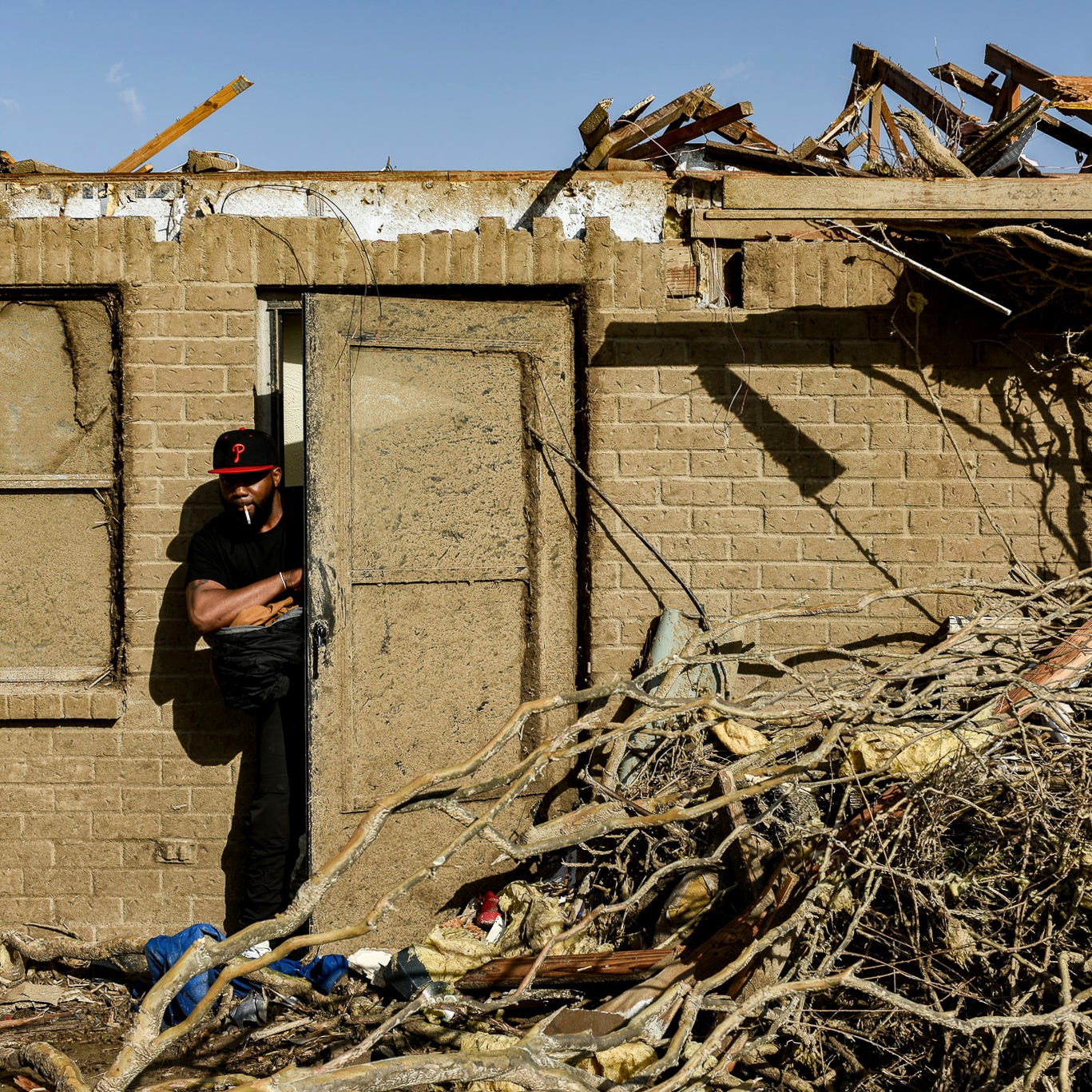 Terry York, a Silver City, Miss., resident exits what's left of his home Saturday, March 25, 2023, following Friday's deadly tornado.