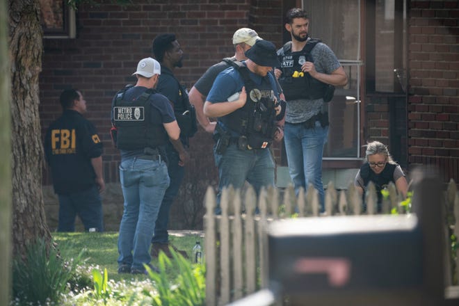 Metro Nashville Police and FBI search and investigate a house in the 3000 block of Brightwood Ave. following a mass shooting at Covenant School, where three children and three adults were killed Covenant School Monday, March 27, 2023 in Nashville, Tenn. The shooter was killed by police on the scene. 