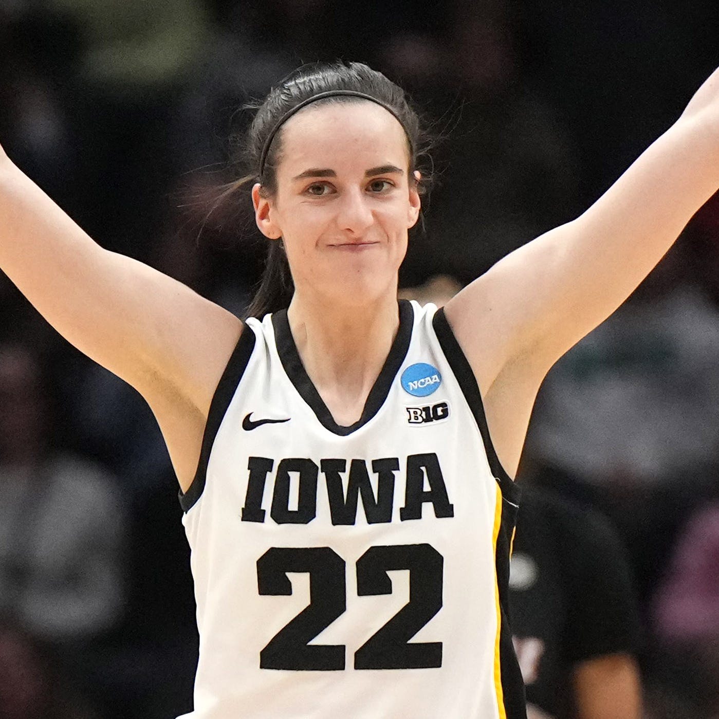 Caitlin Clark celebrates during Iowa's Elite Eight win against Louisville.