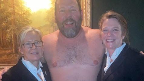 Comedian Bert Kreischer stands for a photo with staff at Jim's Steak House in downtown Peoria. Kreischer visited after performing at the Peoria Civic Center.