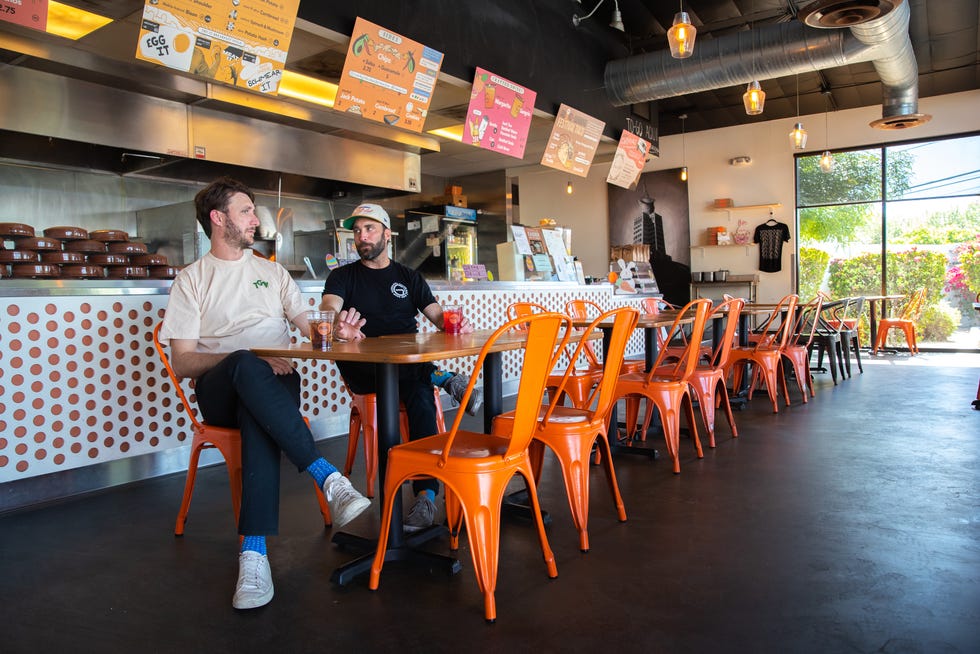Aaron Pool (left) and Jared Pool (right), brothers and co-owners of Gadzooks, sit inside one of their shops in Phoenix on Monday, March 27, 2023.