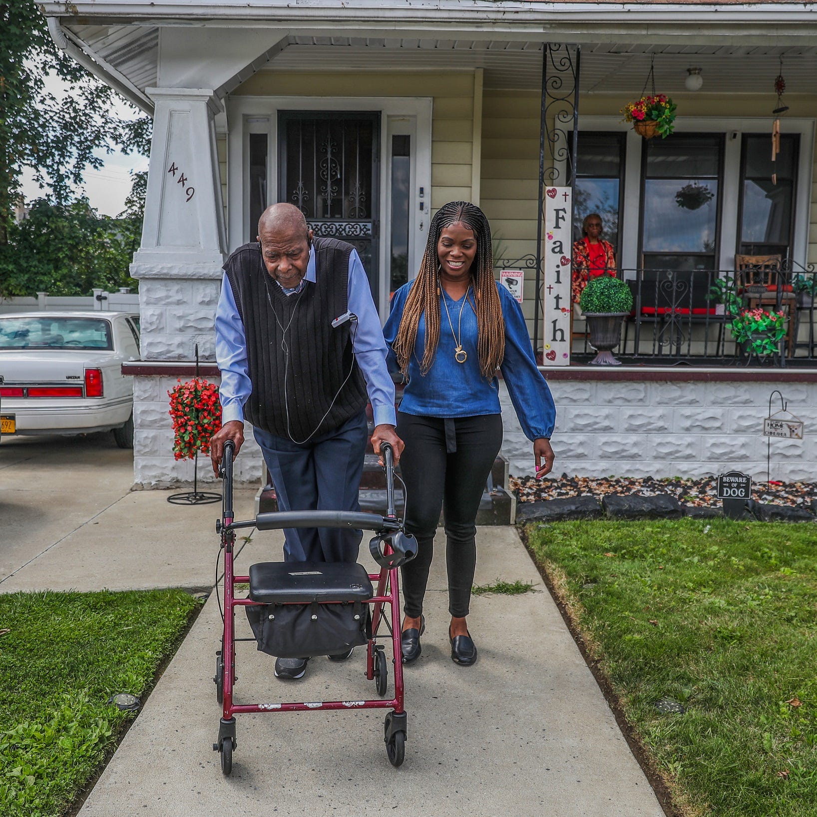 Myzette Howell spots her father Percy Howell as they take a walk around their neighborhood in Buffalo.