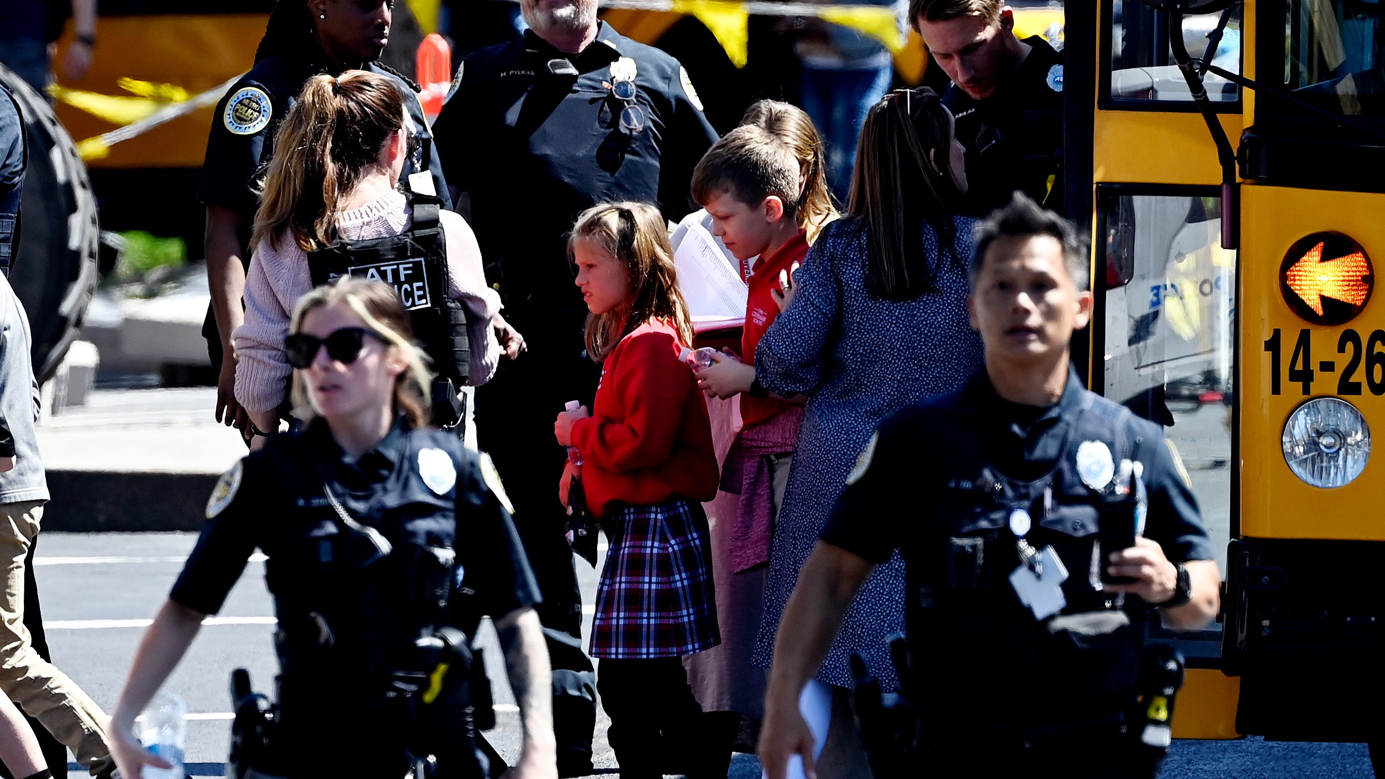 Students from the Covenant School get off a bus to meet their parents at the reunification site at the Woodmont Baptist Church in Nashville, Tennessee.