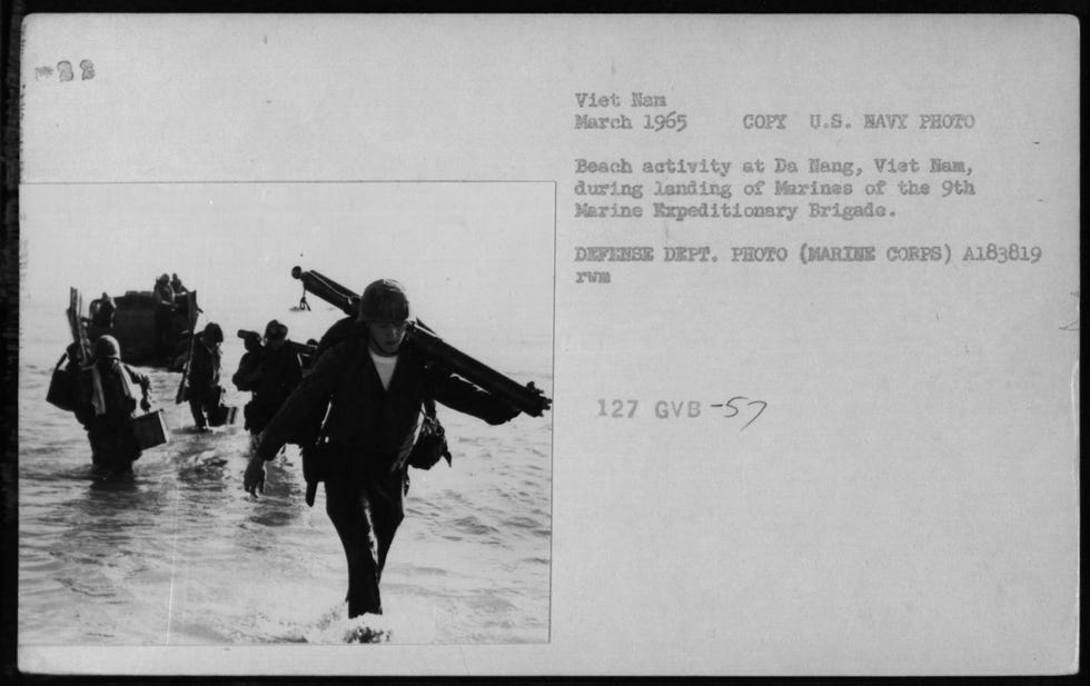 Marines of the 9th Marine Expeditionary Brigade land at Da Nang in early 1965 for Operation Rolling Thunder, a sustained bombing campaign against North Vietnam that marked the first American ground troops in Vietnam.